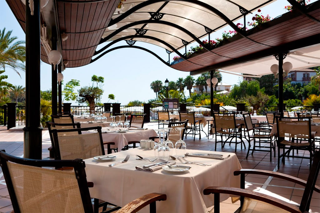 Outdoor dining area with set tables at a restaurant in Tenerife.