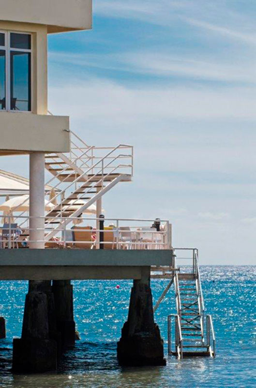 Building over ocean with stairs and railing in Tenerife.