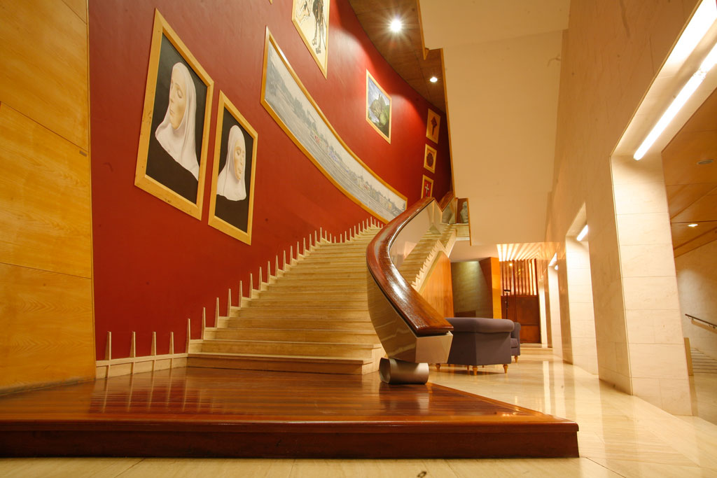 Curved staircase with portraits in an art gallery, Tenerife.