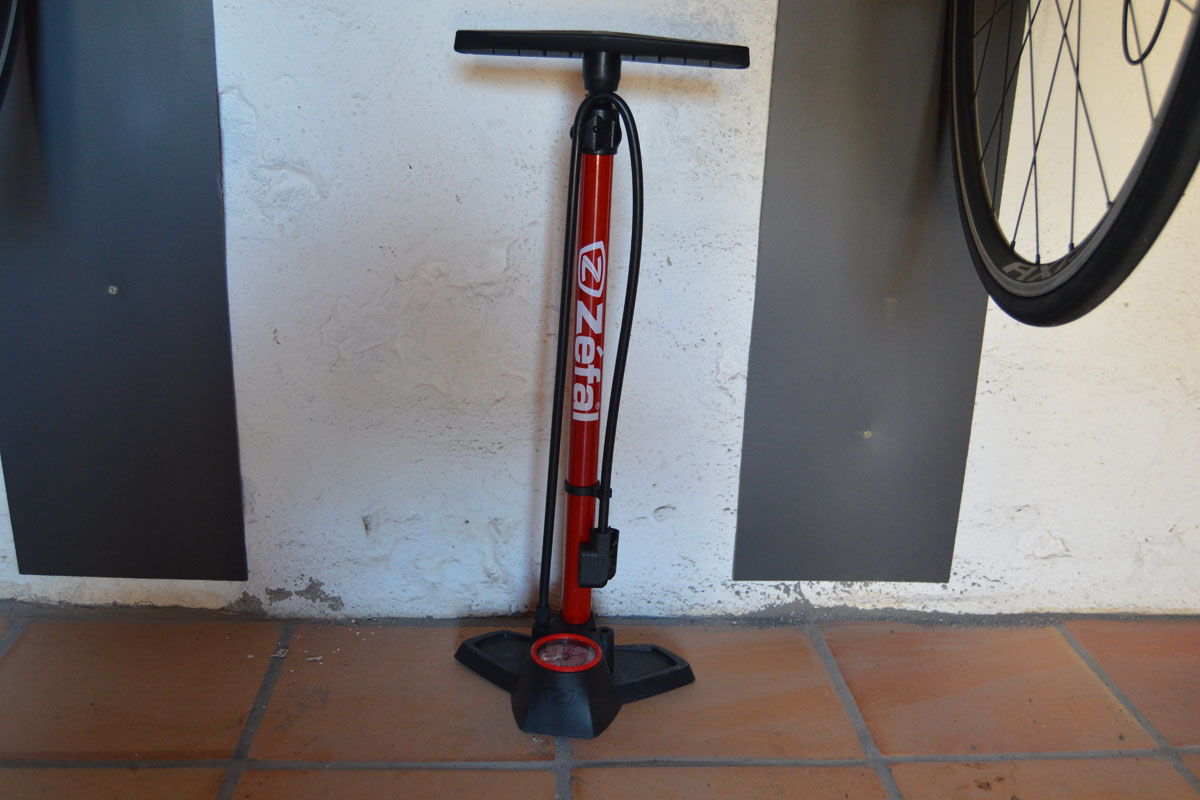 Red Zéfal bike pump against a wall in Tenerife garage.