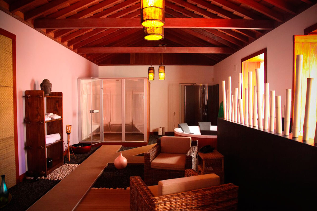 Interior of a relaxation room with wicker chairs and wooden ceiling in Tenerife.