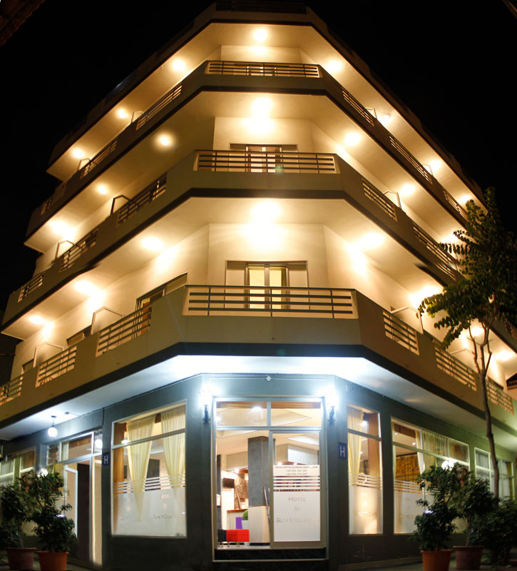 Four-story modern building at night, Hotel San Roque in Tenerife.