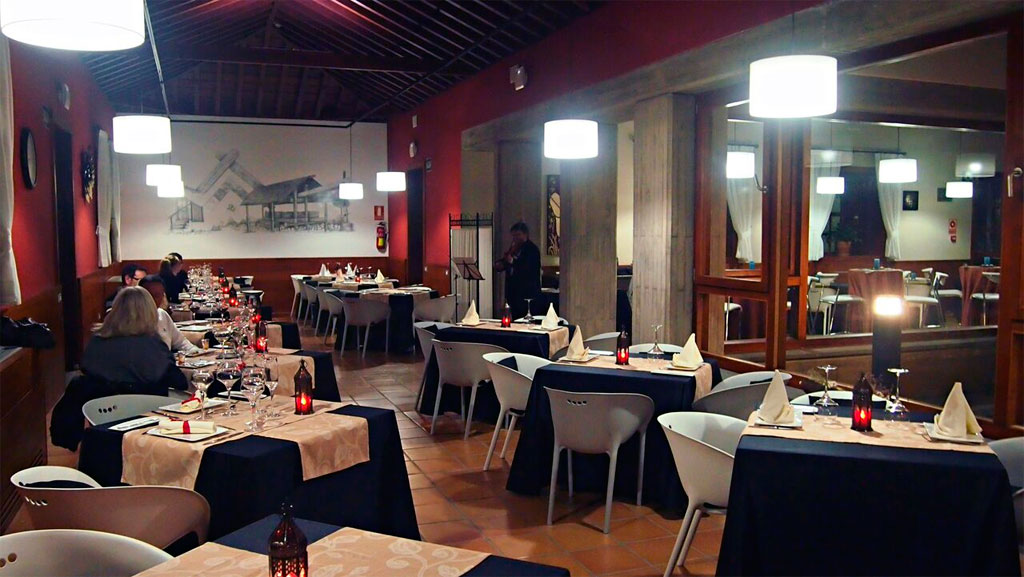 Dining tables set for guests at a restaurant in Tenerife.