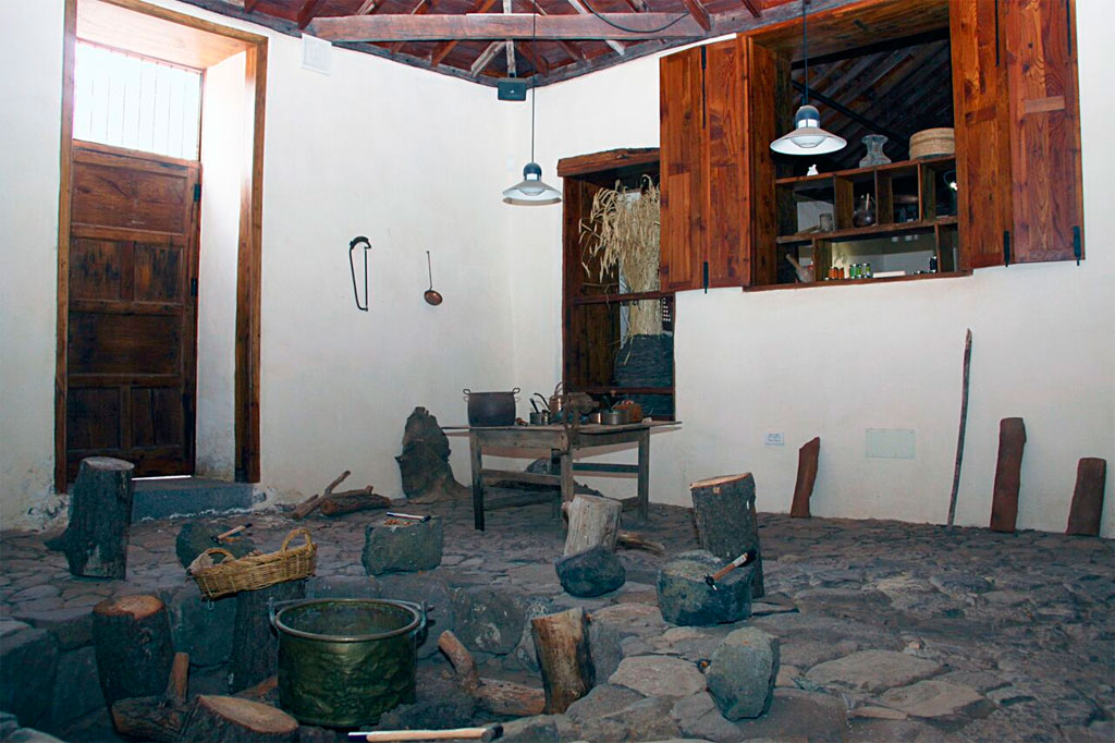 Traditional kitchen interior with rustic tools and furniture in Tenerife.