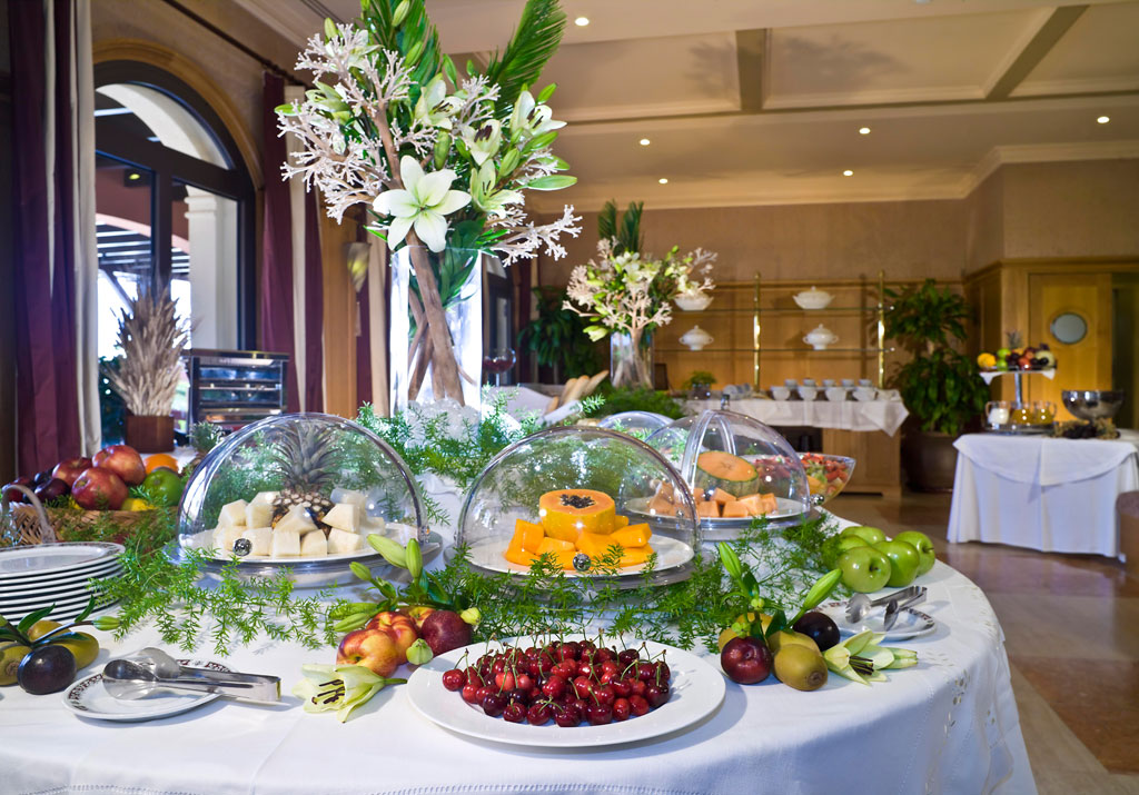 Assorted fruits and cheese platter at a buffet in Tenerife restaurant.