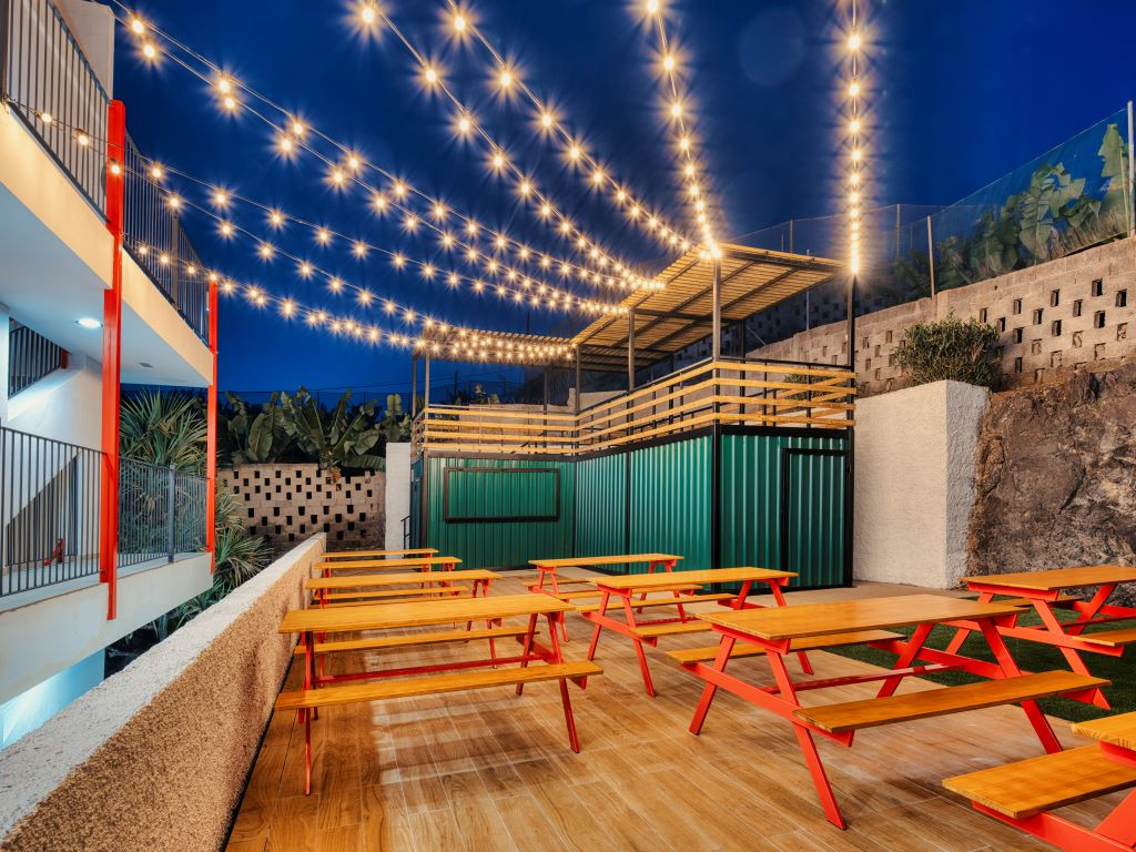 Outdoor tables with hanging lights in Tenerife.