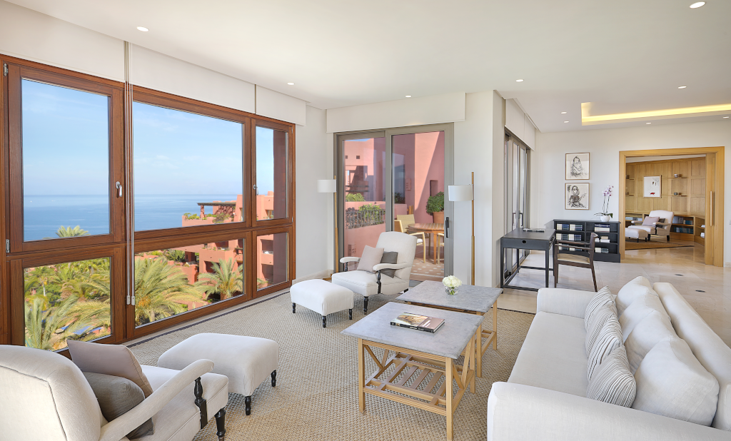 Luxurious living room in Tenerife with ocean view through large windows.