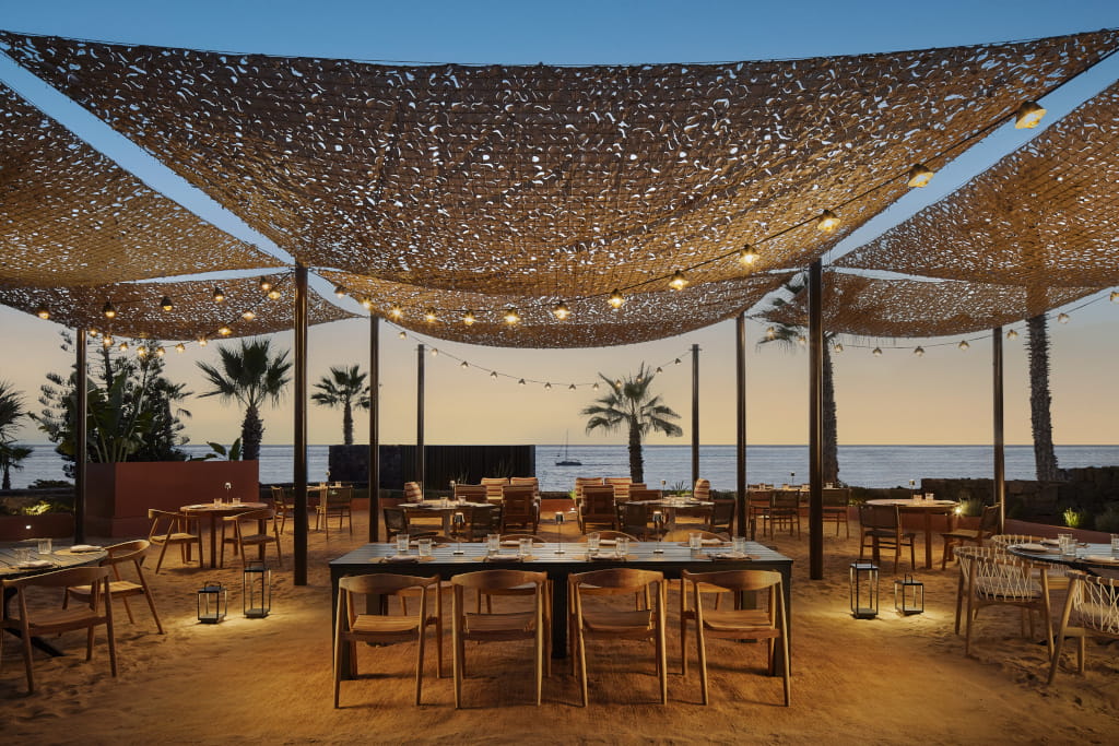 Outdoor dining area with sunset view in Tenerife.