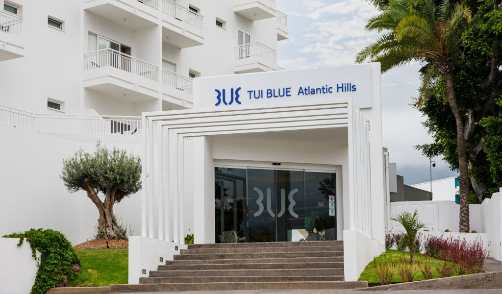 Entrance of TUI BLUE Atlantic Hills hotel with trees in Tenerife.