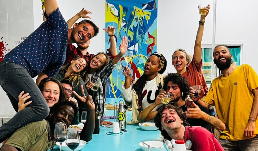 Group of friends celebrating at a table with drinks in their hands in Tenerife.