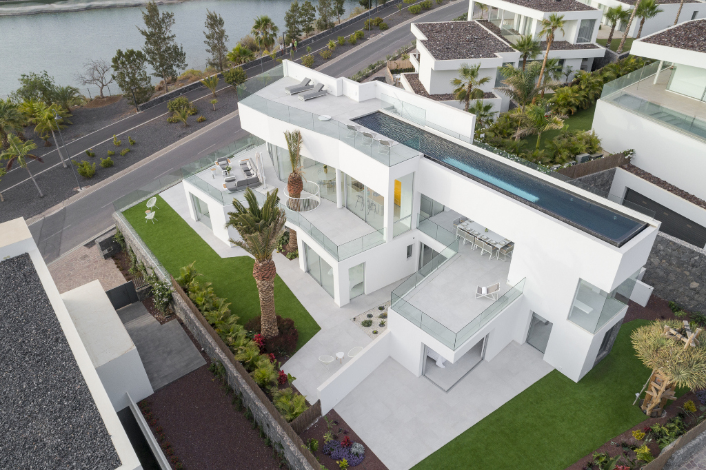 Modern white villa with rooftop pool and garden in Tenerife.