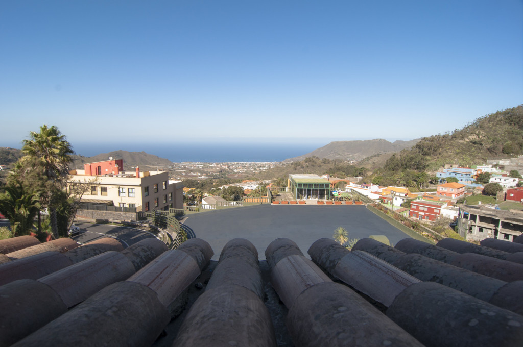 View of Tacoronte rooftops with ocean and mountains in the background, Tenerife.