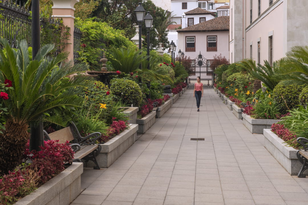 Garden path with person walking in La Laguna, Tenerife.