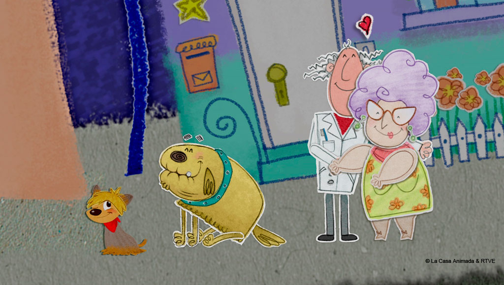 Couple and two animated dogs in front of a house in Tenerife.