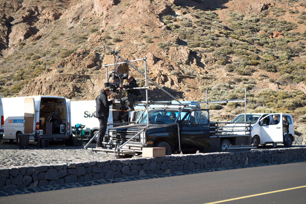Film crew in Teide National Park, Tenerife, with cameras mounted on a vehicle.