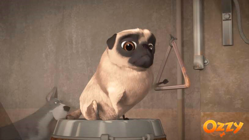Pug puppy playing a musical triangle in a room. Text: Ozzy.