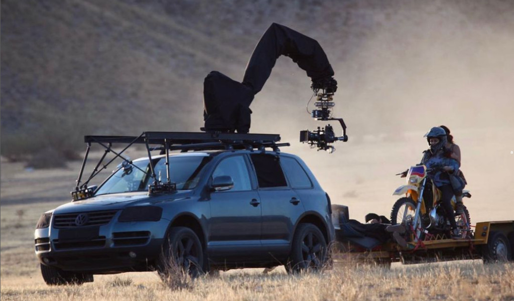 Car with camera mounted filming motorcycle in Tenerife.