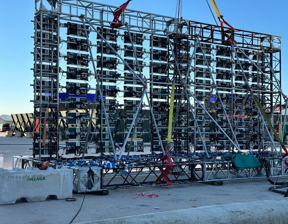 Metal structure with multiple lights and equipment at an event in Tenerife.