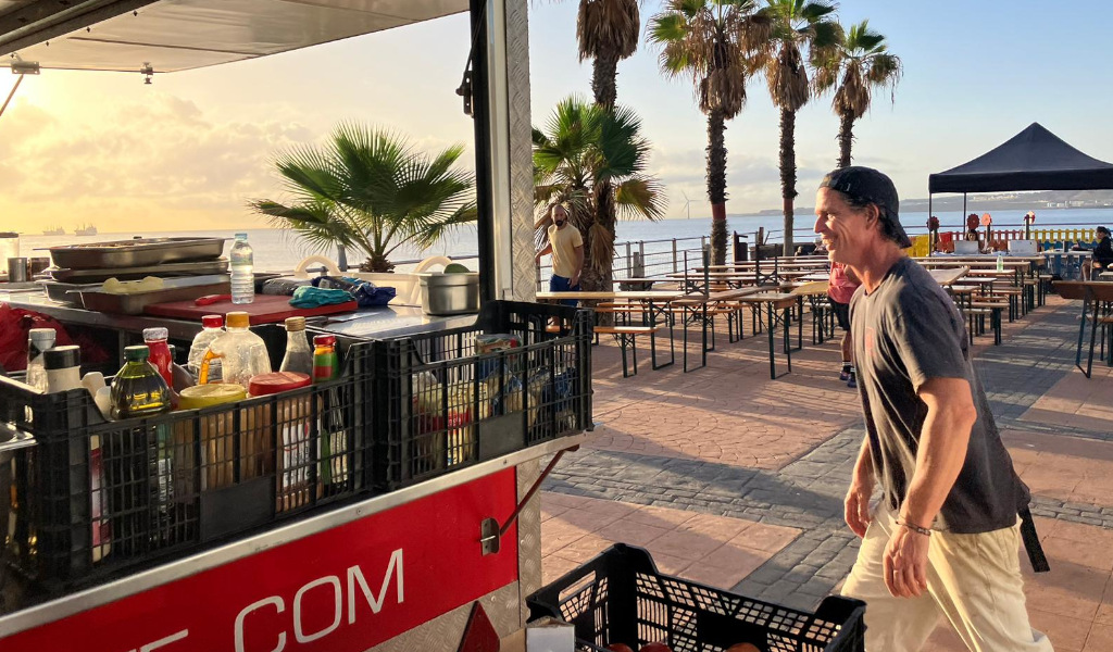Street vendor on the promenade of Santa Cruz de Tenerife at sunset.