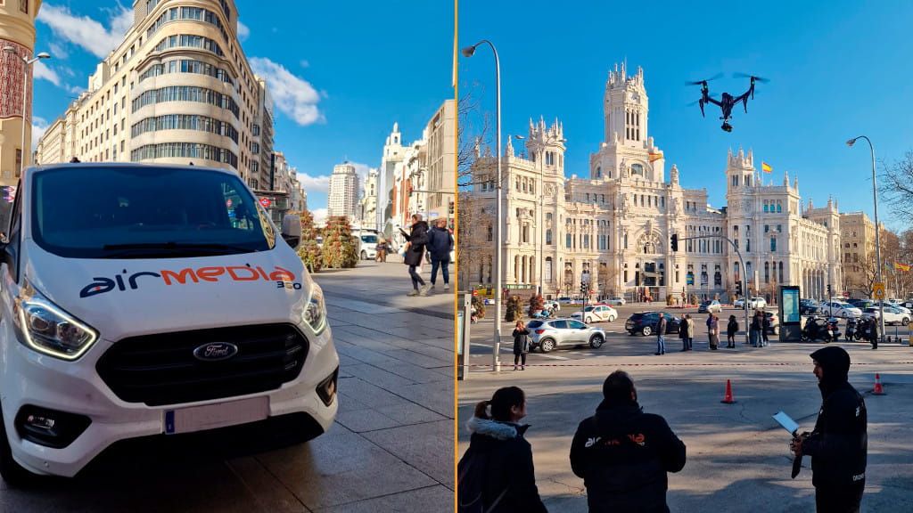Van and team operating drone on an urban avenue in front of a historic building in Madrid