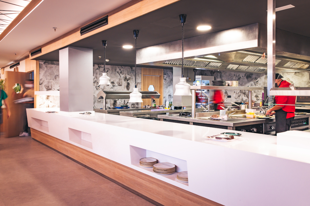 Modern cuisine in Tenerife restaurant with chefs preparing food.