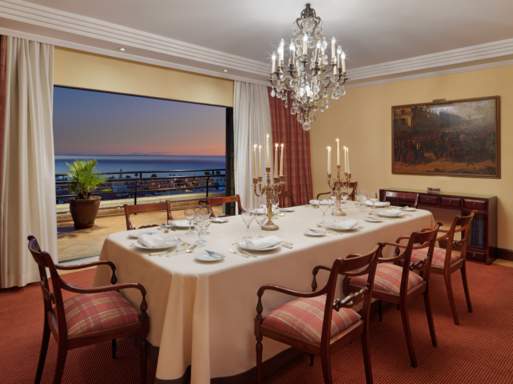 Dining room with elegant table and sunset views in Tenerife.