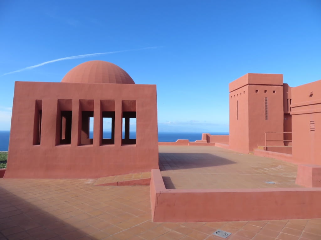 Modern architecture in Tenerife with blue sky and sea in the background.
