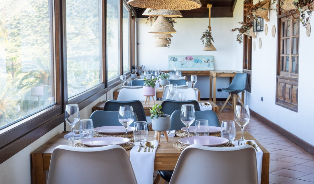Dining room with set tables and panoramic views of Tenerife.