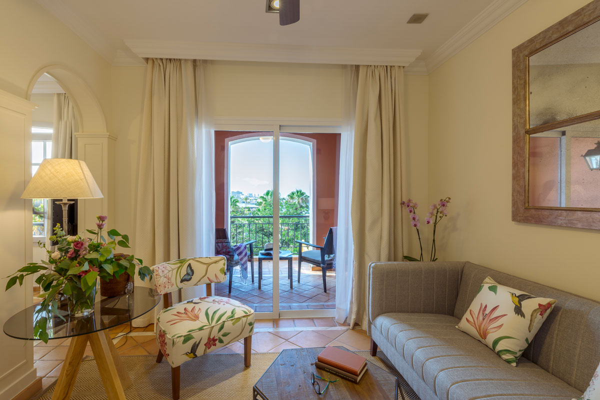 Living room decorated with furniture and balcony view in Tenerife.