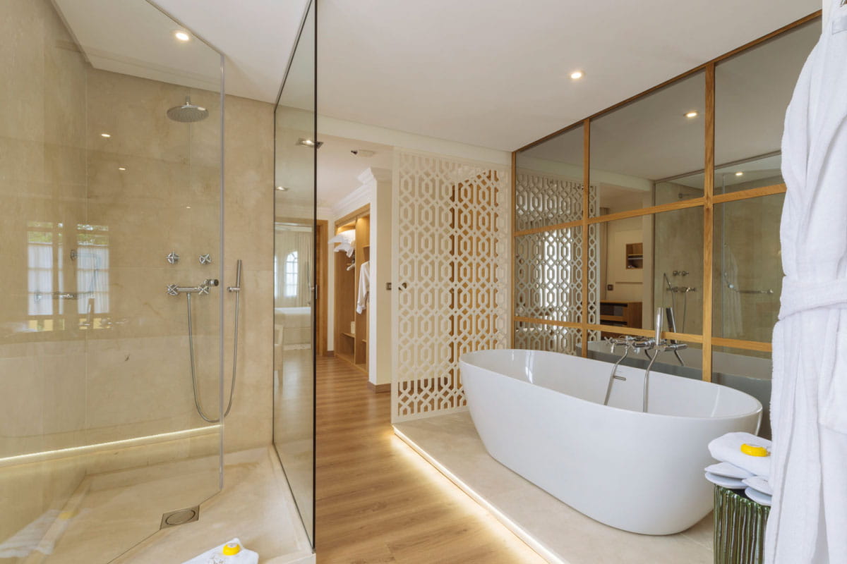 Modern bathroom with bathtub, shower and elegant decoration in a hotel in Tenerife.