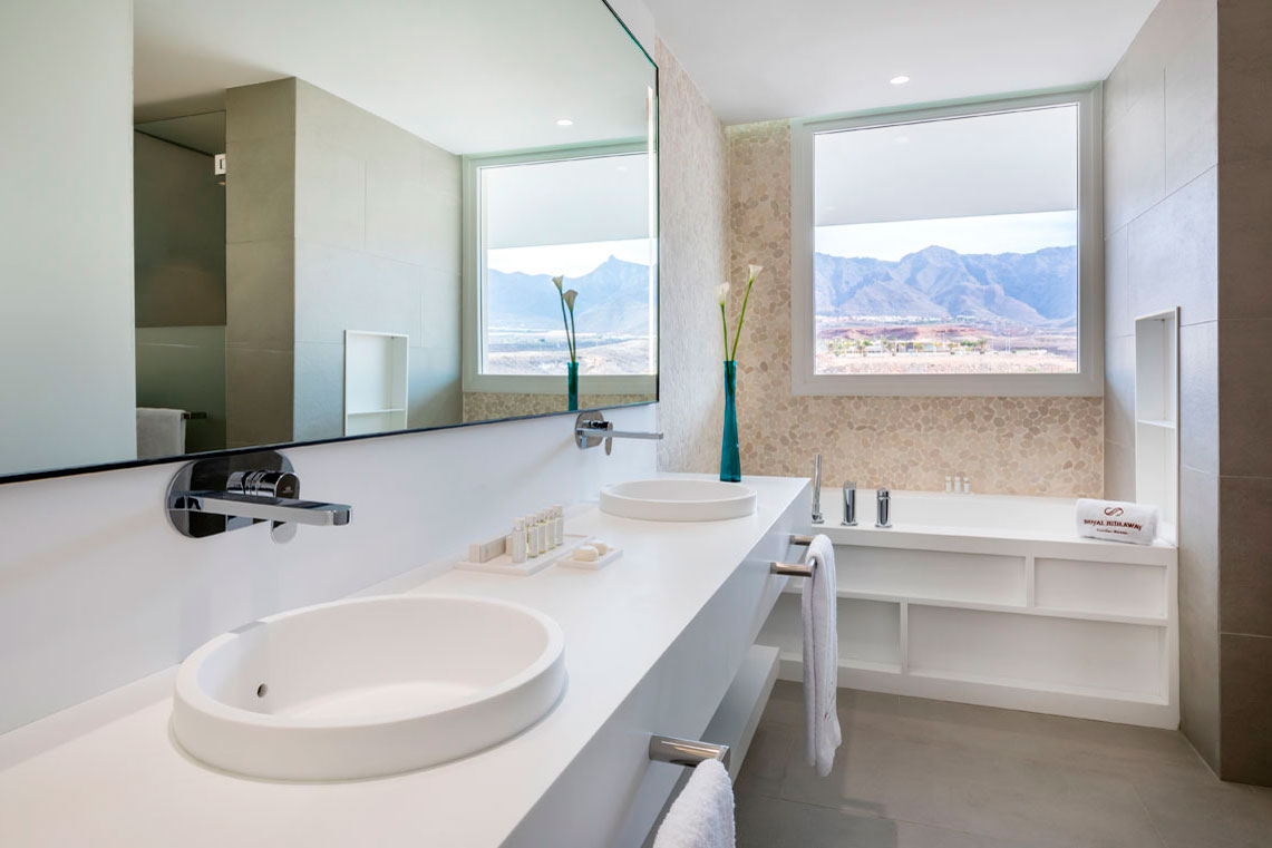 Modern bathroom with double sink and window with views in Tenerife.