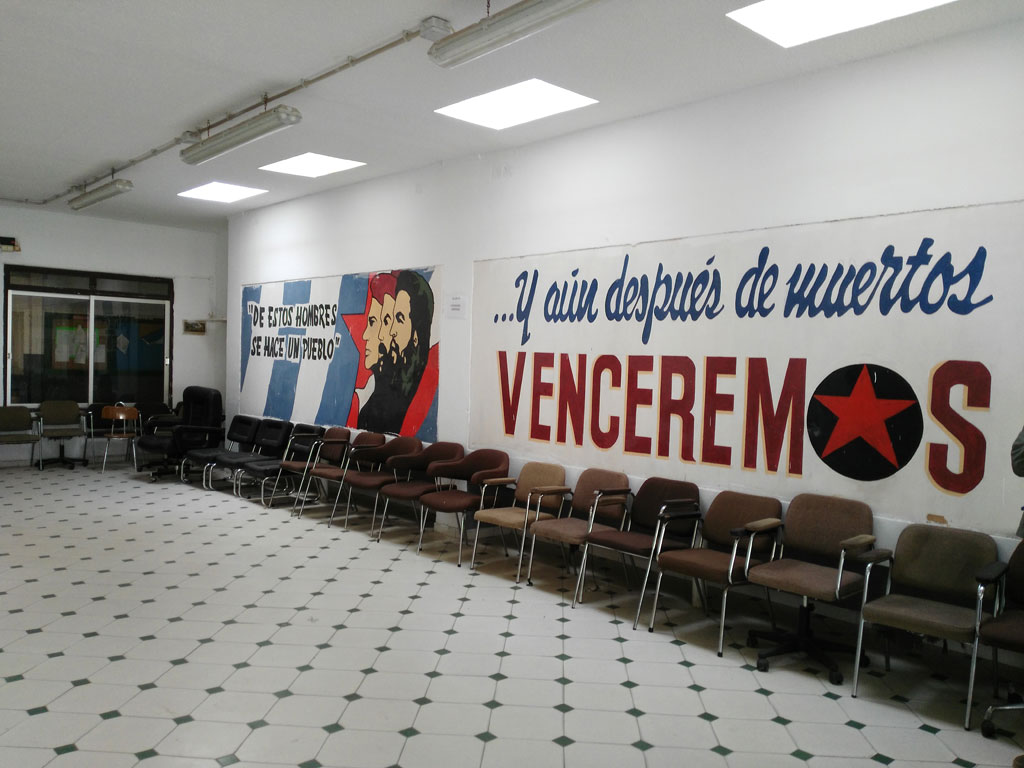 Room with chairs and murals that say From these men a people is made and We will overcome.