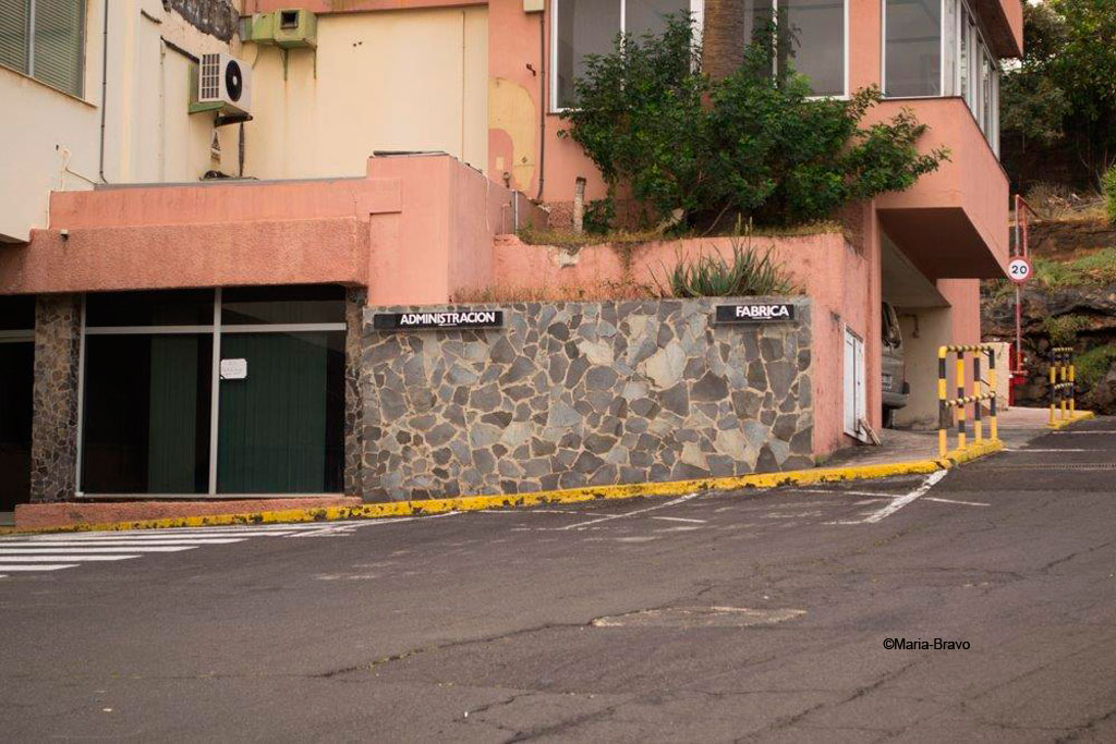 Entrance to a building in Tenerife with Administration and Factory signs.