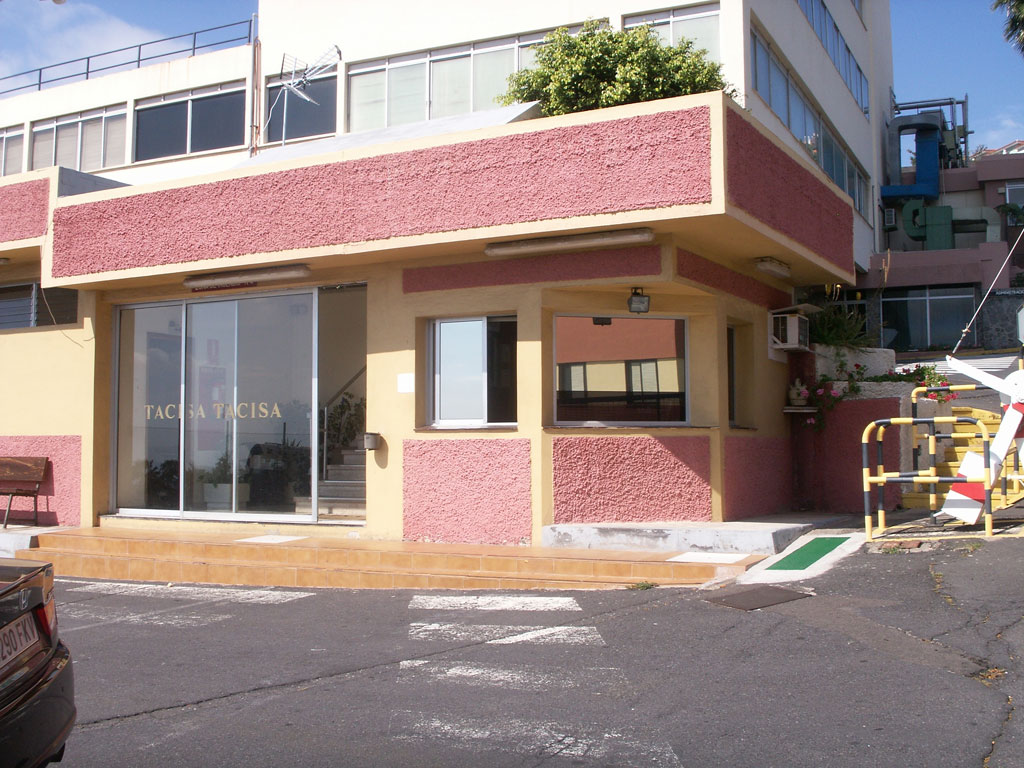 Entrance to a building with the text TACISA TACISA on the door in Tenerife.