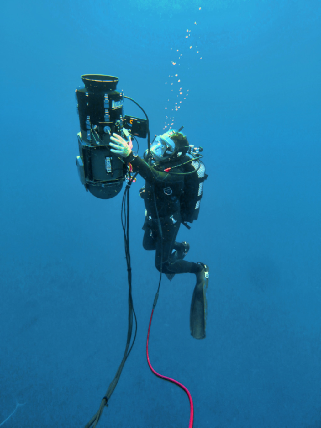 Diver handling underwater research equipment in Tenerife.