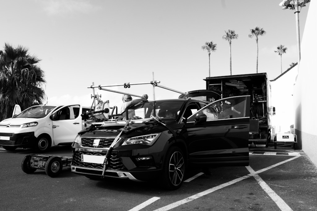 Car with film equipment parked next to a van in Tenerife.