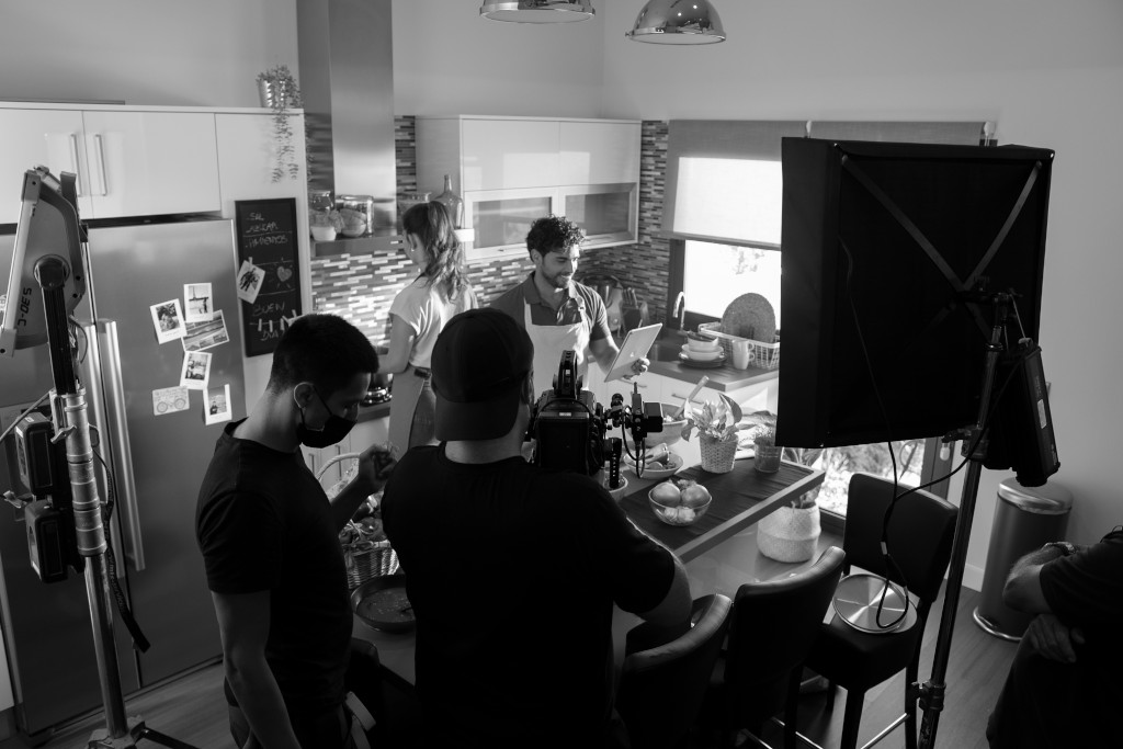 Filming in a kitchen with film crew in Tenerife.