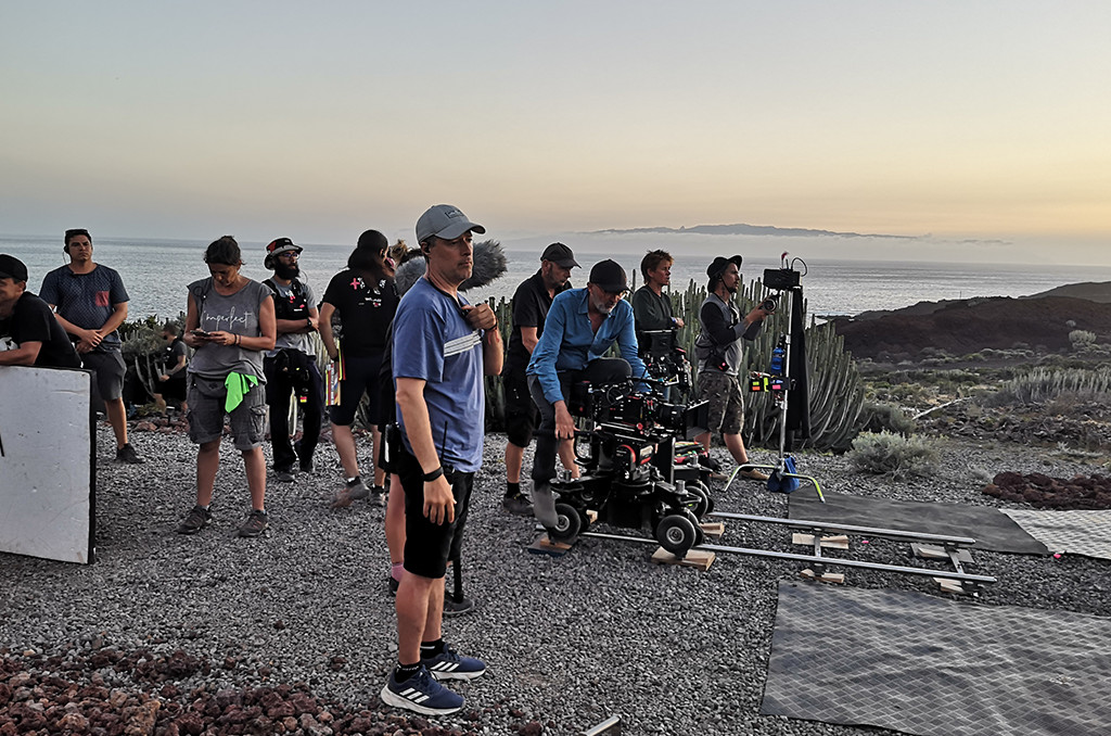 Film crew working on the coast of Tenerife at sunset.