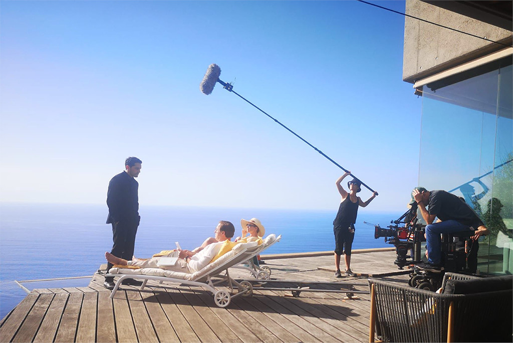 Scene shooting with sea view in Tenerife, film crew and actors.