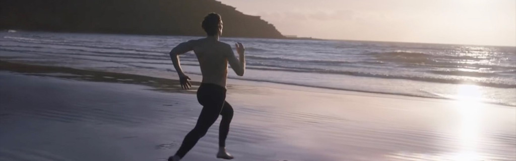 Person running on the beach at sunset in Tenerife.