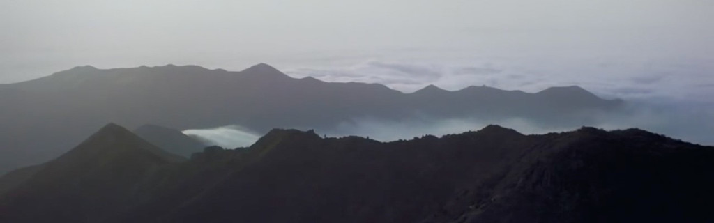 Mist-shrouded mountains at sunrise in Anaga Rural Park, Tenerife.