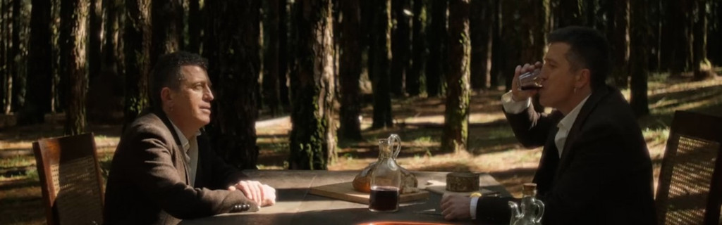 Men sharing wine in a forest in Tenerife.
