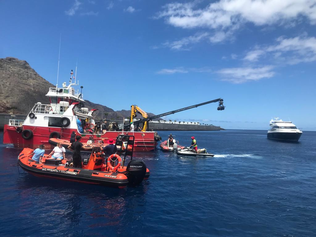 Boats in the port of Tenerife with a rescue boat and film crew.