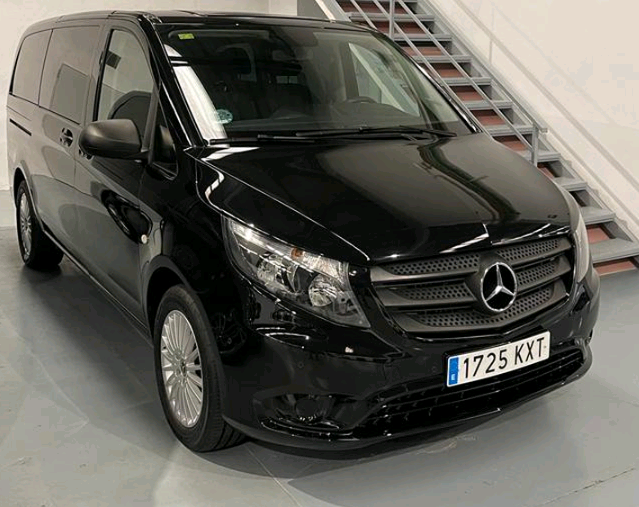 Black Mercedes Benz van parked in a garage in Tenerife. Registration 1725 KXT.