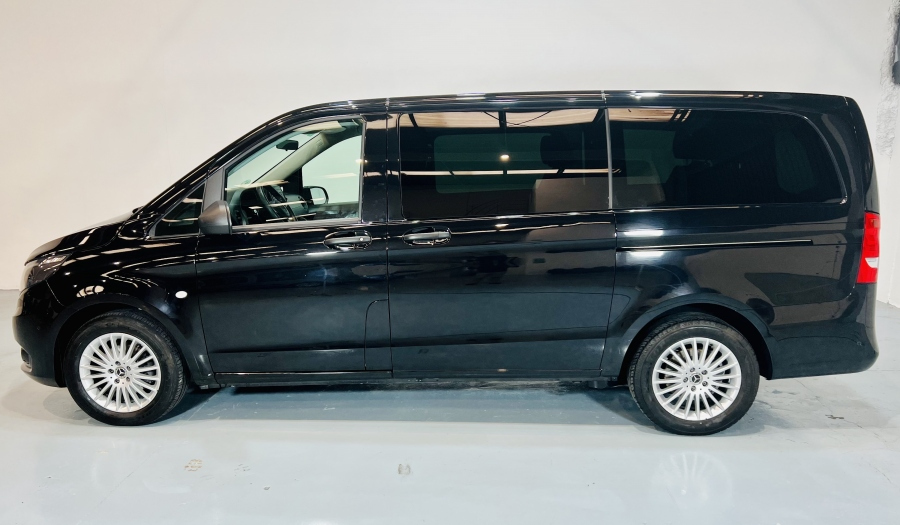 Black minivan parked in profile in a studio, Tenerife.