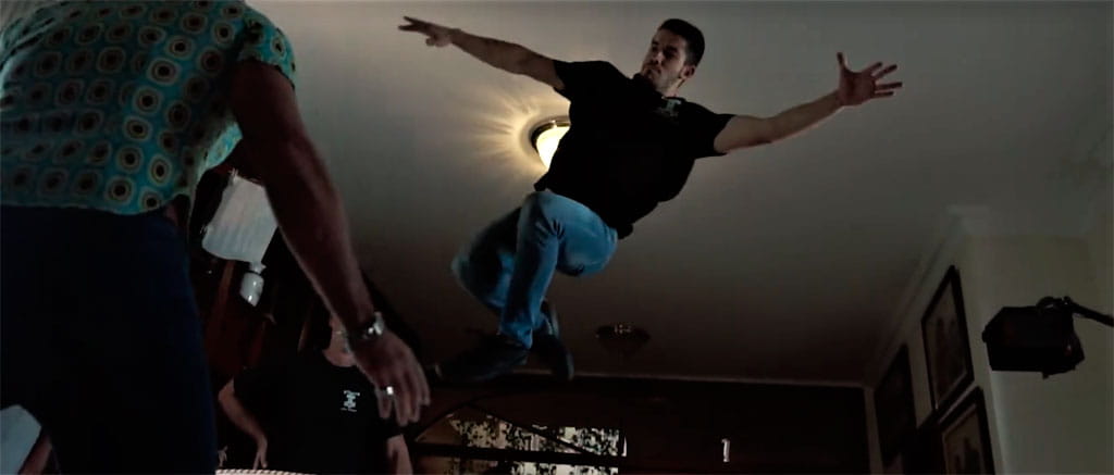 Man jumping in the air inside a room in Tenerife.