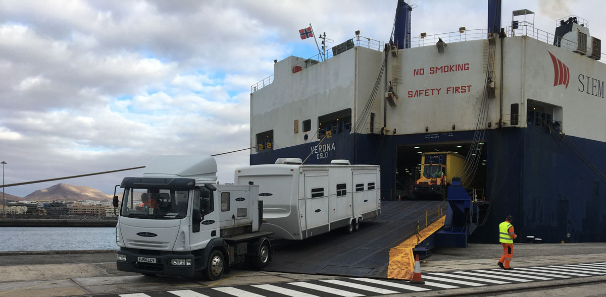 Truck with trailer leaving a ferry in the port of Tenerife.