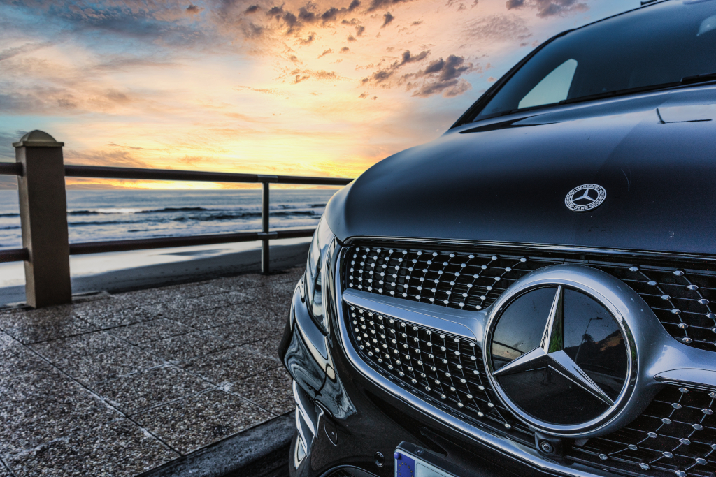 Front of Mercedes car at sunset on the coast of Tenerife.