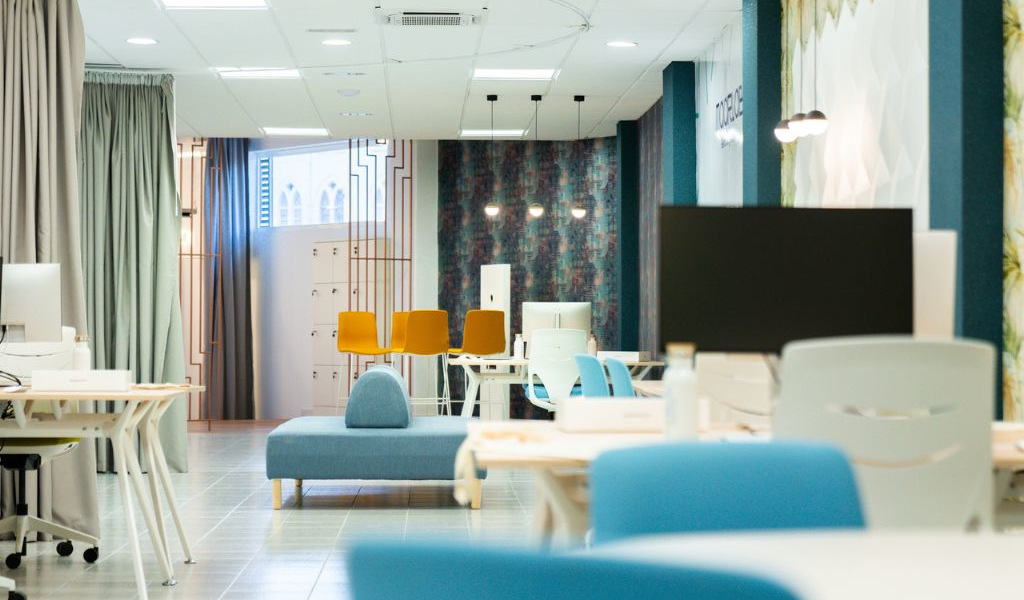 Modern office space with desks, chairs, and computers in Tenerife.