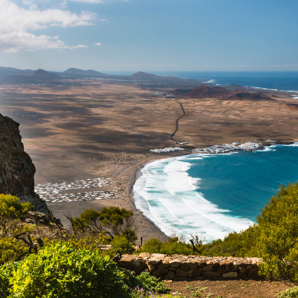 Coastal view with rolling waves and sandy beach in Tenerife.